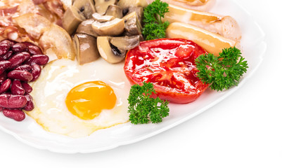 Fried egg with sausage on plate.