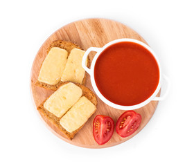 Bowl of tomato soup with toast.