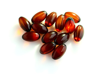 Various pills on white background