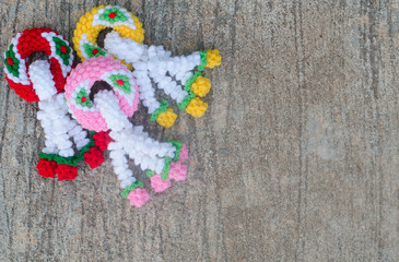 garland knitting on cement background
