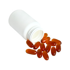 Omega 3 gel capsules next to a bottle on white background