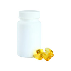 Omega 3 gel capsules next to a bottle on white background