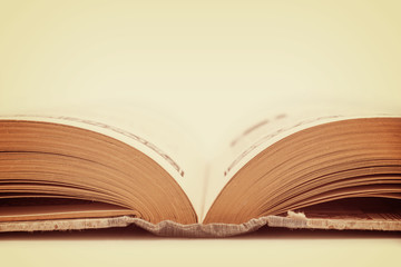 Old fashioned opened book, side view, vintage background