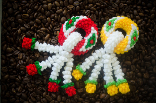 garland knitting on coffee bean background