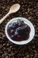 Blueberry cupcake on coffee bean background