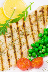 Fototapeta na wymiar Grilled fish fillet with vegetables.