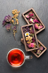 herbal tea with honey and dried herbs and flowers. top view
