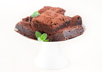 Chocolate cake brownies on light background