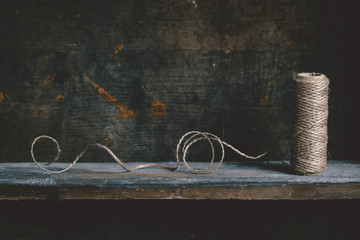 Jute twine on wooden shelf
