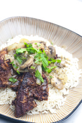 fried livres with mushroom sauce and rice