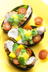 avocado filled with chicken salad and avocado dip