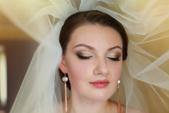 Portrait of a beautiful bride with bright makeup
