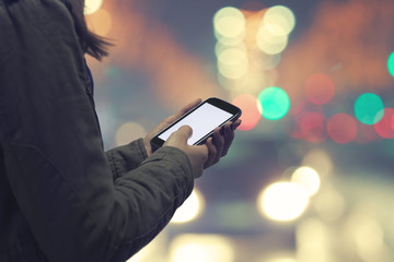 Using cellphone at night while crossing the street.