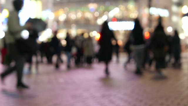 Anonymous crowd of people walking in Shibuya Tokyo, Japan.