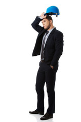 Happy businessman with blue hard hat.