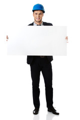 Businessman enginner holding empty banner.