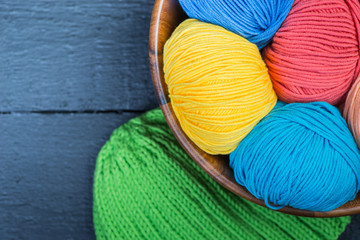 Colorful knitting yarn balls in basket