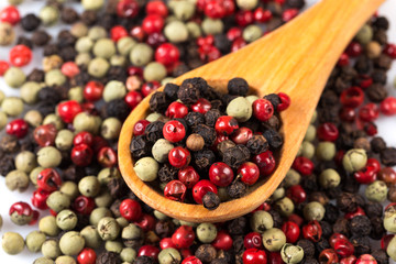 Pepper seasoning mix in wooden spoon