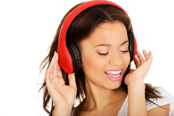 Fototapeta premium Woman with headphones listening to music.