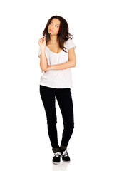 Thoughtful woman with pencil.