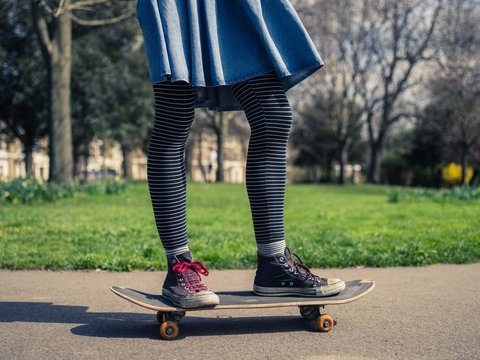 Young woman skateboarding in the park