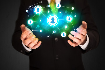 Businessman holding social media network