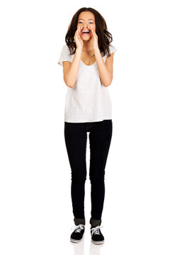 Young woman whispering gossip.