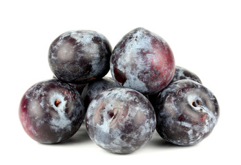 black plums, isolated on white background