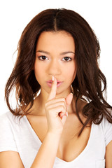 Naklejka premium Woman making a hush gesture.