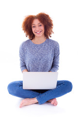 Naklejka premium Black African American student girl using a laptop