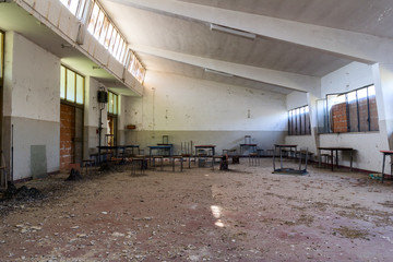 abandoned company canteen with stools and tables
