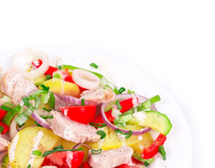 Warm meat salad with vegetables.