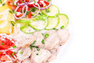 Warm meat salad with vegetables.