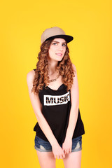 Naklejka premium Portrait of a happy young sexy swag woman in stylish clothes 