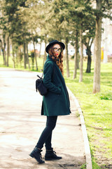 Fototapeta premium Outdoor fashion portrait of stylish pretty hipster girl