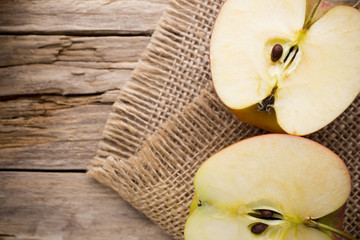 Yellow grapefruit slice on a plate.