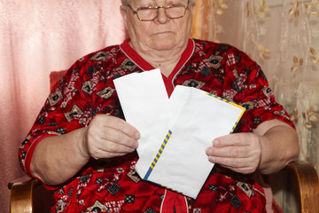 Elderly woman and open letter