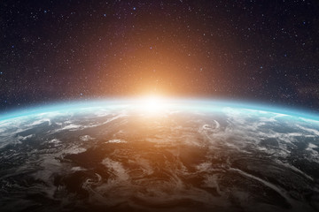 Sunrise over planet Earth in space