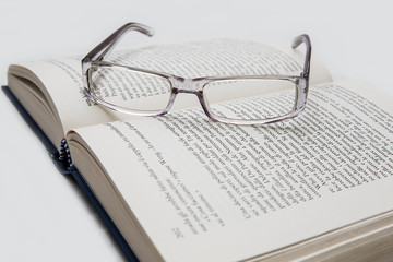 eyeglasses on the page of a book