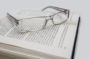 eyeglasses on the page of a book