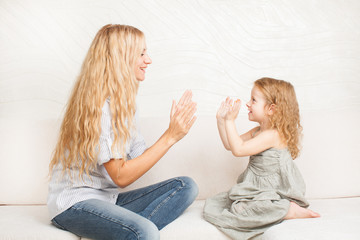 Mother playing with baby