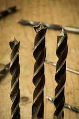 drill bits on wooden table