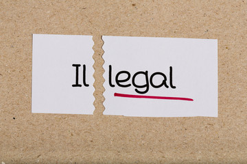 Sign with word illegal turned into legal