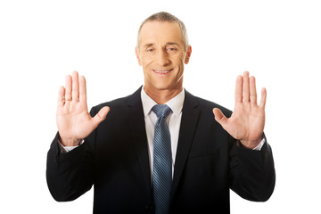 Businessman pressing abstract screen