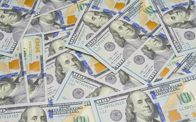 One hundred dollars pile as background