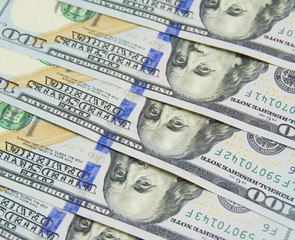 One hundred dollars pile as background