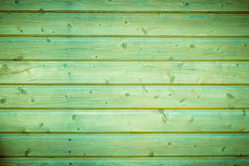 Old green painted wood wall - texture or background