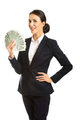 Businesswoman holding a clip of polish money