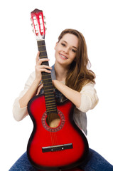 Fototapeta premium Young smiling girl with guitar isolated on white