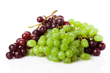 Black and white grapes isolated on white background